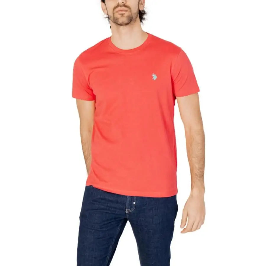 Man wearing U.S. Polo Assn. men t-shirt in red with jeans, apparel accessories.