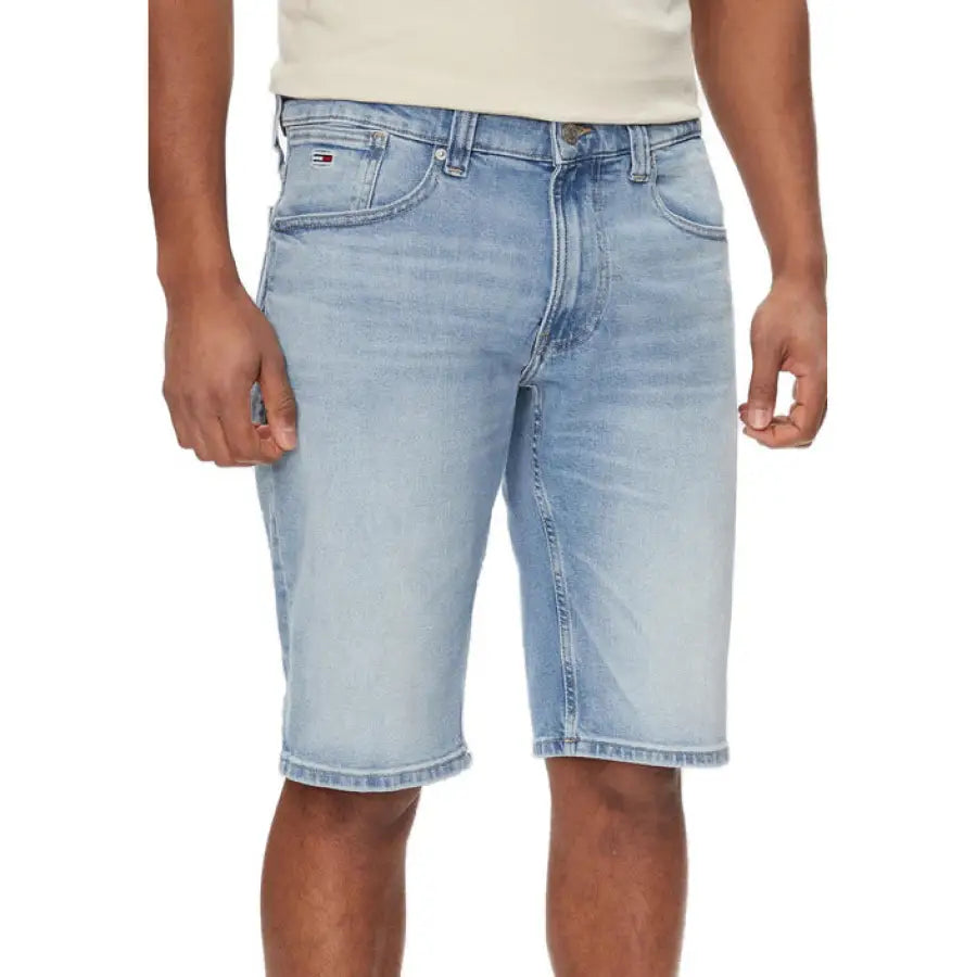 Man wearing Tommy Hilfiger Jeans in white t-shirt and blue shorts