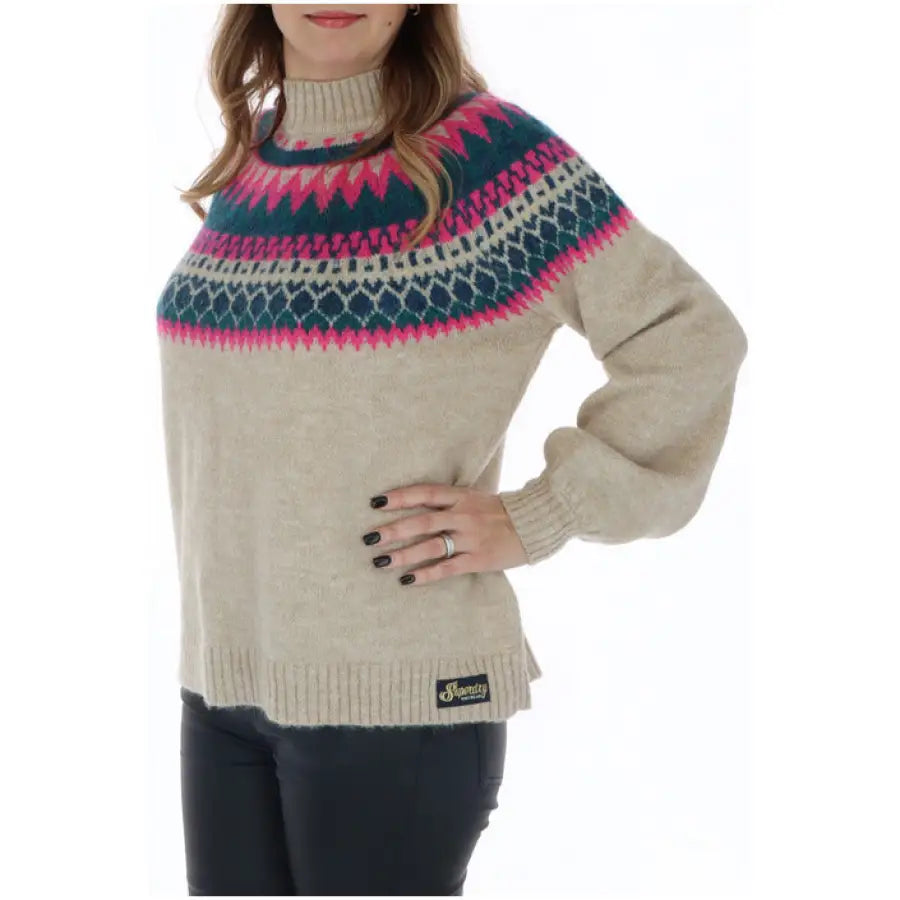 Superdry woman wearing colorful patterned Superdry knitwear sweater